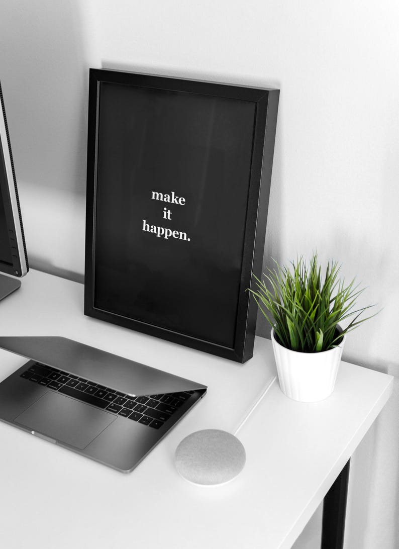 Make It Happen black poster with desk setup